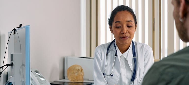 Doctor talking with a patient about methadone vs suboxone for opioid addiction treatment.