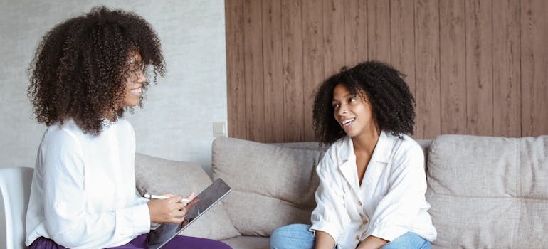 Woman talking about her struggles with the stages of alcoholism with her therapist.