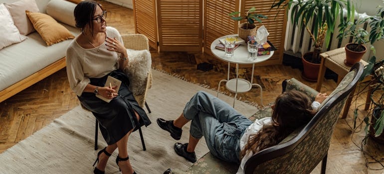 Therapist explaining the stages of alcoholism to a patient.