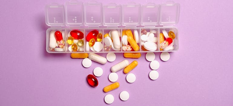 Pills and vitamins in a pill box.