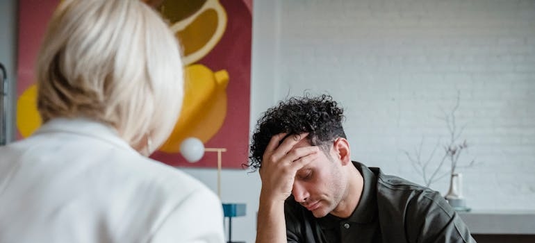 Man talking about her struggles with OCD and trauma with her therapist.