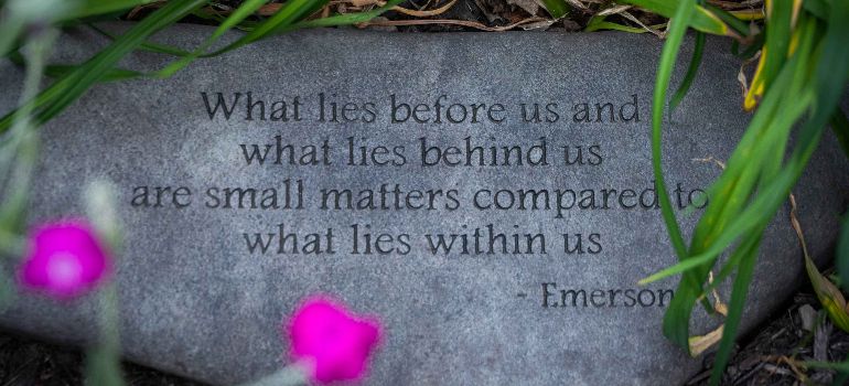 a stone with Emerson quote on it