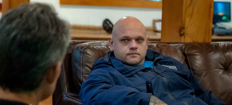 a man and a therapist sitting at little creek lodge