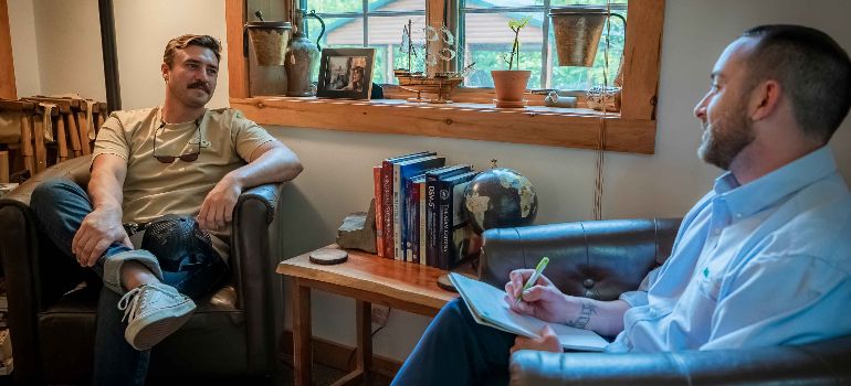 a therapist talking with a patient during CBT session