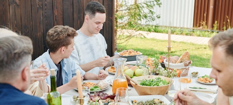Family eating lunch in the garden.