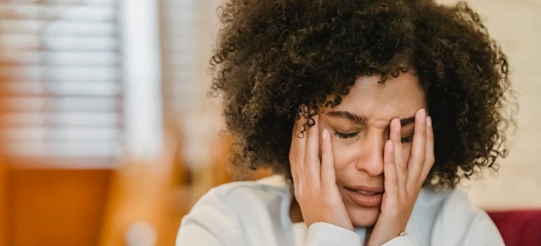Woman worrying about her issues with alcohol and anxiety.