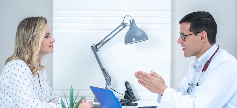 Doctor explaining a diagnosis to a patient.