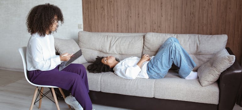Woman talking about self-sabotage in recovery with her therapist.
