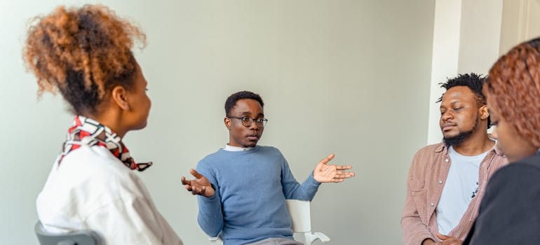 People in group therapy discussing their issues with weekend drinking culture in Pennsylvania.
