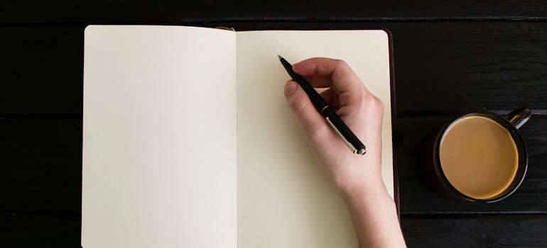 Person writing down what helps them with finding purpose in recovery.