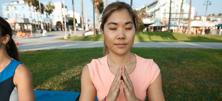 Woman doing yoga and practicing breathing exercises.