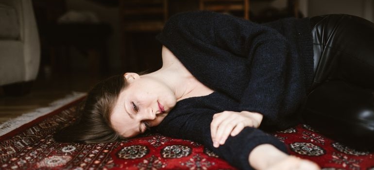 Woman lying on the floor.