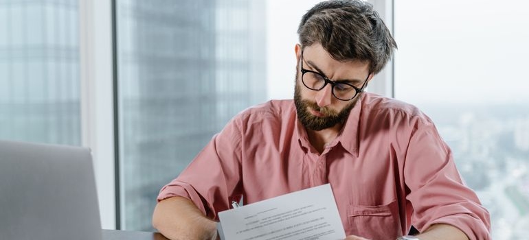 Man reading his explanation of benefits documents.