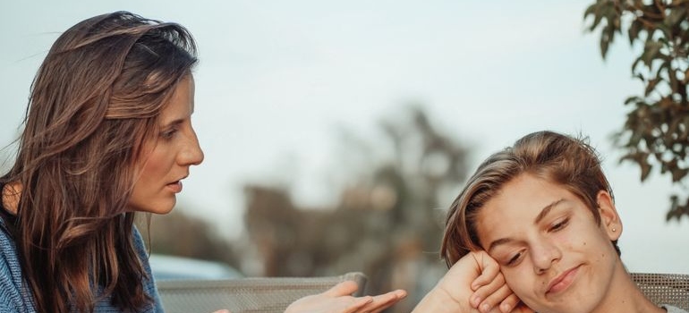 Woman talking about consequences of teen drug abuse with her teenage son.